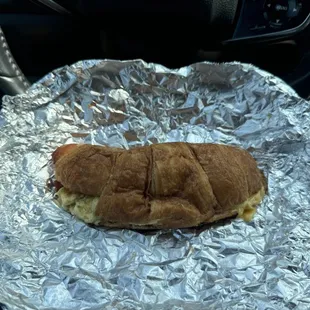 Bacon egg n cheese croissant sandwich $4.95 (instagram: @issa.cheatday)