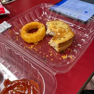 a sandwich and donut with ketchup