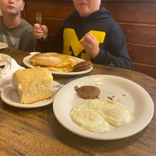 two boys eating breakfast
