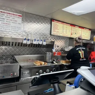 Busy busy, taking orders, grilling, frying, and bantering with each other and the regulars. The menu is Aug 2024.