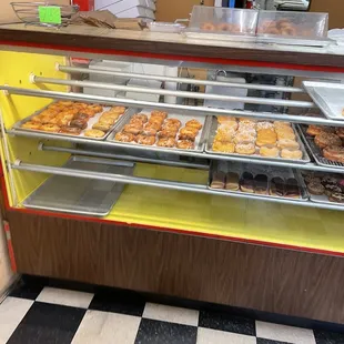 a display case filled with donuts