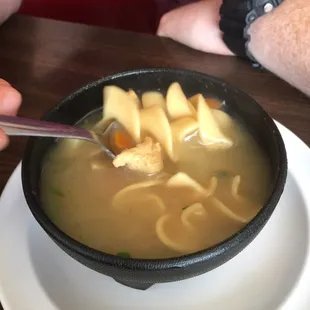 a bowl of soup on a plate