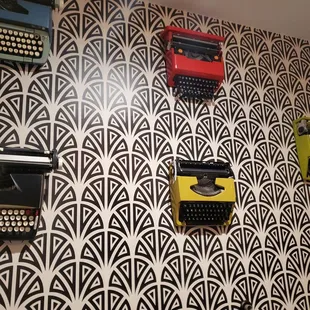 typewriters on a wall