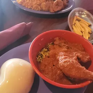 My plate fufu with egusi soap and chicken my husband's talpia with plantain and spicy rice