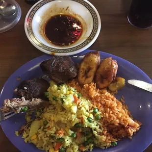 1/2 Jollof 1/2 Fried Rice with Beef and asked for some chili sauce. Very good.