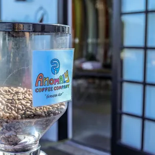 a coffee grinder filled with coffee beans