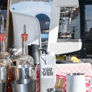 a coffee maker and cocktail glasses