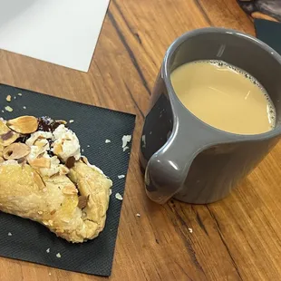 a pastry and a cup of coffee