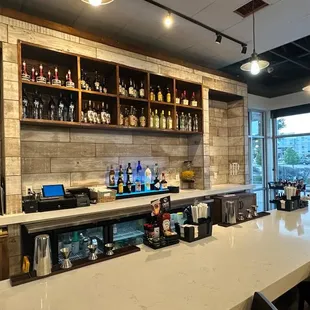 a bar with bottles of alcohol
