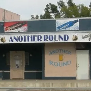 the corner of a building with a sign on it