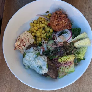 Couscous with kofta and zhouk tahini grain bowl