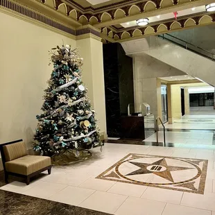 a christmas tree in a lobby