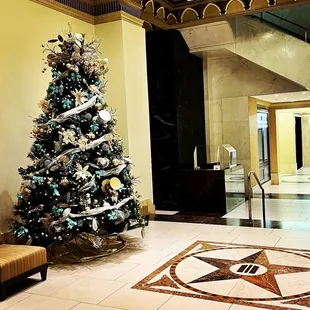 a christmas tree in a lobby