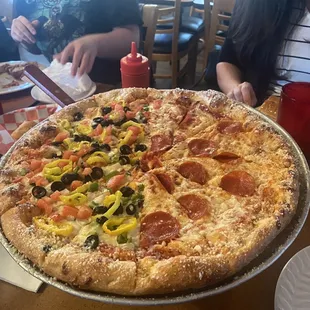 Half veggie half pepperoni pizza