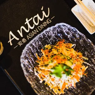 a plate of food and chopsticks