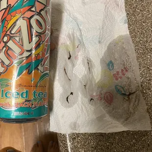 Weird, dark brown, moss like particles/strings in my Arizona ices tea with peach flavor