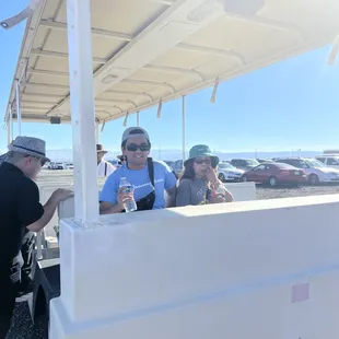 Free parking lot tram that brings you to the front gates