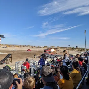 Fans watching a monster fire truck blow fire!