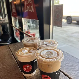 three cups of coffee on a table