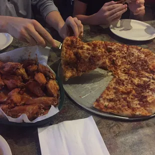 Extra large hand tossed with bacon and 30 hot wings.