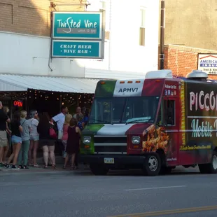 a food truck parked on the side of the road