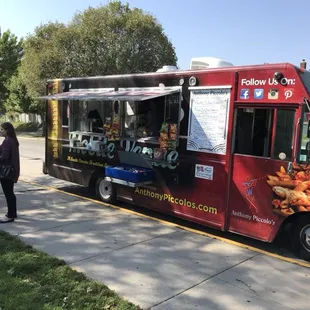 a food truck parked on the side of the road