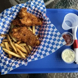 a tray of fried fish and fries