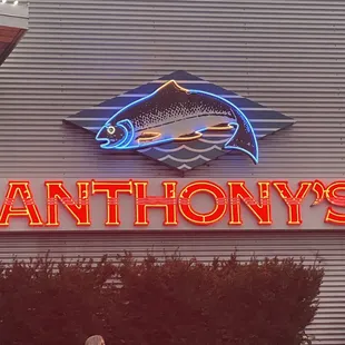 a man standing in front of the sign