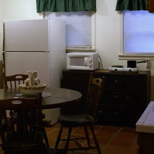 Fiesta Suite - This suite includes a dining table, wet- bar, 2-burner range-top, microwave, and full size fridge.