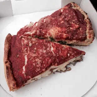 Slices of the meat and veggie (onions are large and plentiful) pizza! Yum