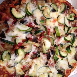 Traditional round with eggplant, zucchini and sundried tomatoes. (I think they did go light on the cheese on this one - yay.)