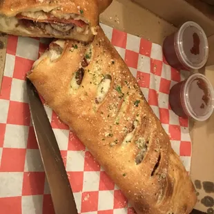 a sandwich with meat and cheese