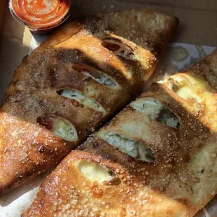 three pieces of pizza in a box