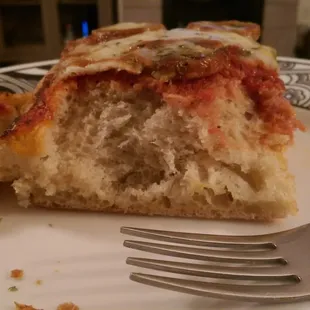 1 1/2 inches of bread, 1/8 inch of toppings. Hmm.