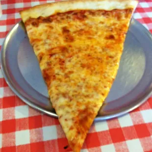 Slice of thin crust NY Style Pizza.