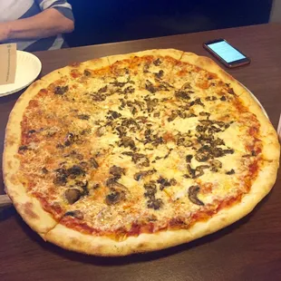 Mushroom, sausage and cheeses pizza