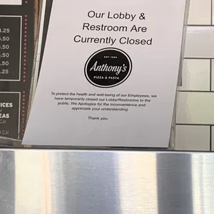 Sign not allowing us to use the bathroom.