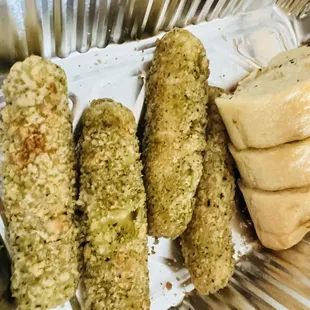 a plate of breadsticks and bread