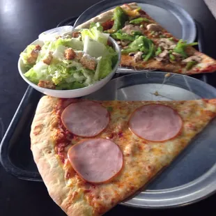 Neapolitan slices with ham, another with mushrooms and bell peppers.  Plus Caesar salad.