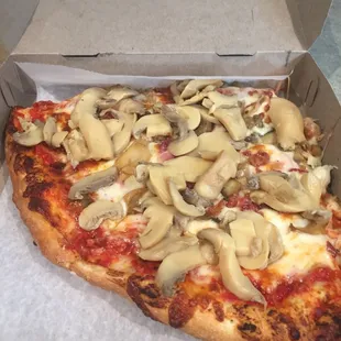 a slice of pizza in a box