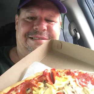 a man in the back seat of a car