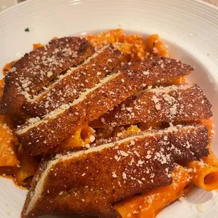 a plate of pasta and meat
