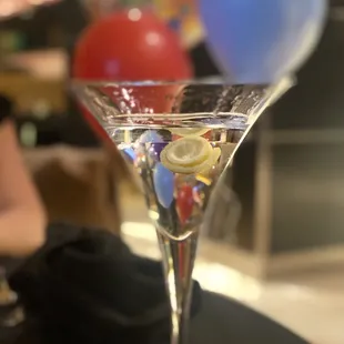 a martini glass filled with a martini