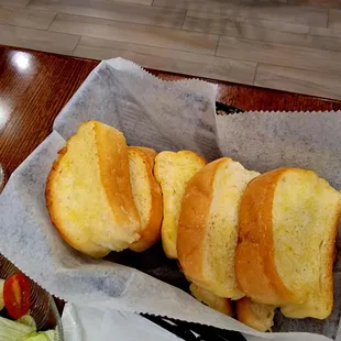 a basket of bread and salad