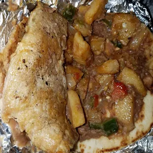 1 whole pork chop with refried beans and potatoes. A meal in itself.