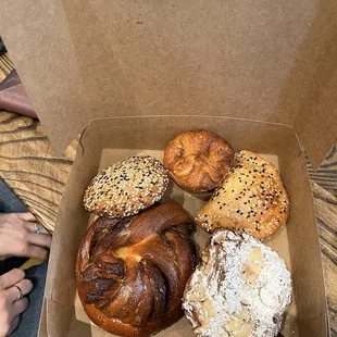 a box of assorted pastries on a table