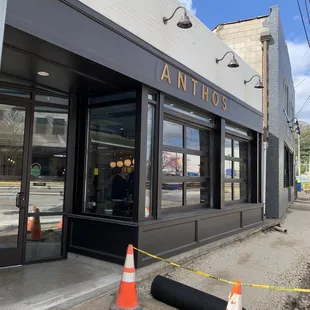 the entrance to a building with construction cones in front of it