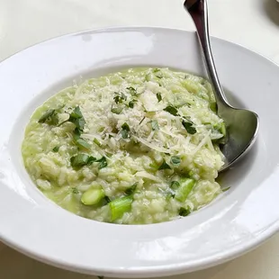 a bowl of soup with a spoon in it