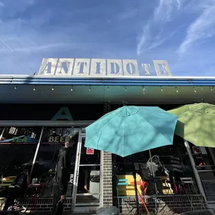 two umbrellas in front of a store