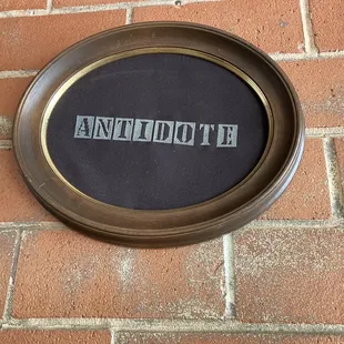 Antidote cross stitch on the gallery wall.